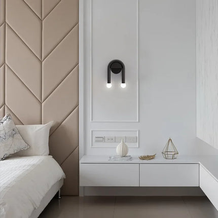Modern Wall Light with Sculptural Arch Design | Matte Black Iron & Frosted Glass for Warm Ambient Glow