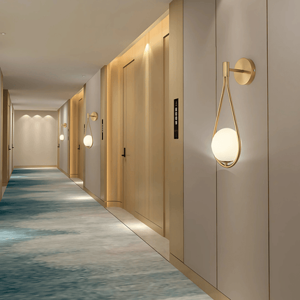 Teardrop Wall Light with Frosted Glass Globe | Modern Accent Lighting for Elegant Interiors